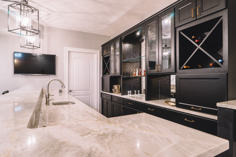 Photo of a large classic galley breakfast bar in Philadelphia with a submerged sink, marble worktops, dark hardwood flooring, recessed-panel cabinets, black cabinets and mirror splashback.