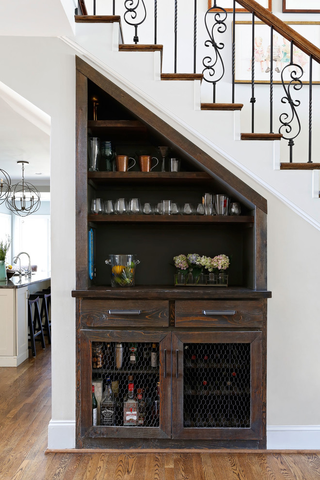 Home bar - transitional single-wall light wood floor home bar idea in Nashville with no sink, shaker cabinets, dark wood cabinets, wood countertops and brown backsplash