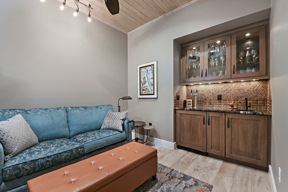 Example of a mid-sized transitional single-wall light wood floor and beige floor wet bar design in Orlando with an undermount sink, shaker cabinets, medium tone wood cabinets, marble countertops, brown backsplash and mosaic tile backsplash