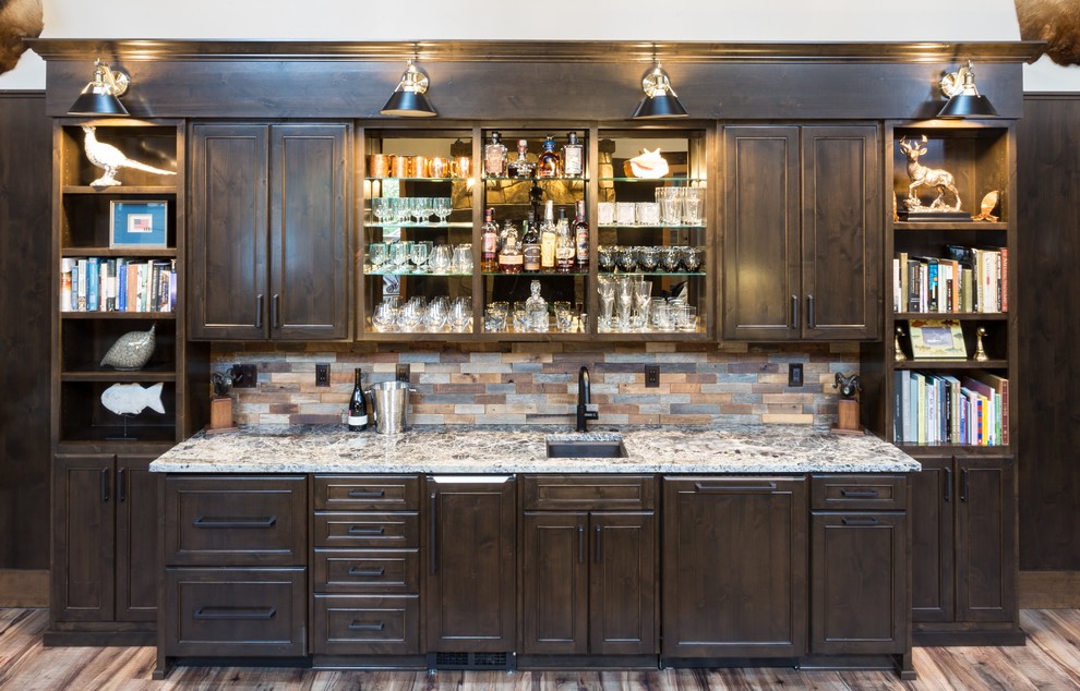 Inspiration for a large rustic single-wall dark wood floor and brown floor wet bar remodel in Portland with a drop-in sink, shaker cabinets, brown cabinets, quartzite countertops, multicolored backsplash, ceramic backsplash and multicolored countertops