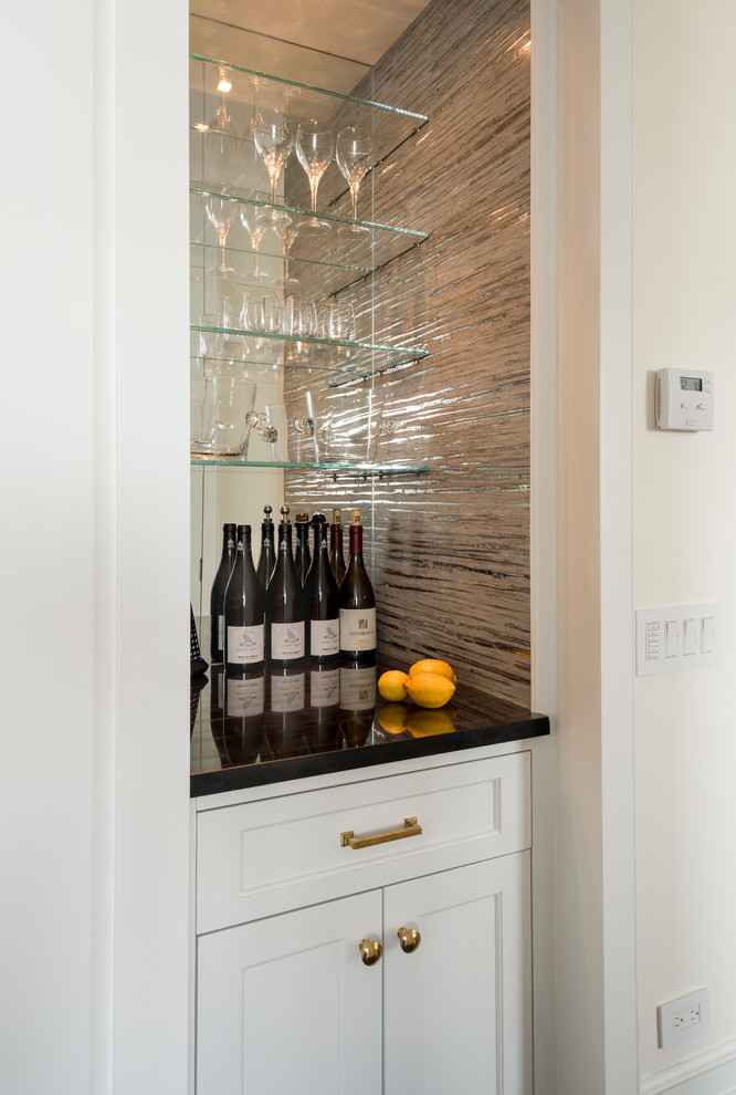Design ideas for a small classic single-wall home bar in New York with shaker cabinets, white cabinets, marble worktops, multi-coloured splashback and mirror splashback.
