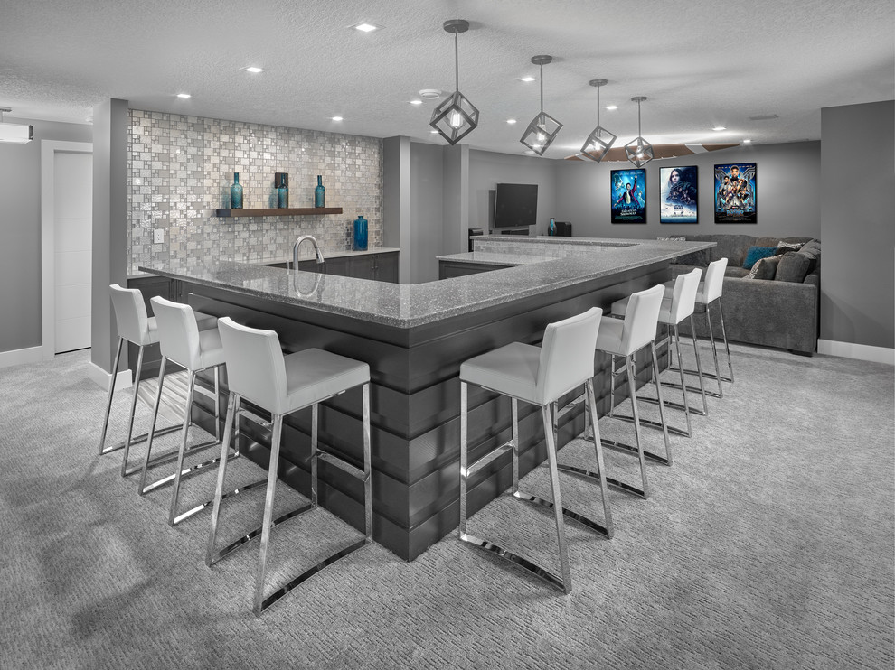 Seated home bar - mid-sized contemporary u-shaped seated home bar idea in Edmonton with louvered cabinets, gray cabinets and gray countertops