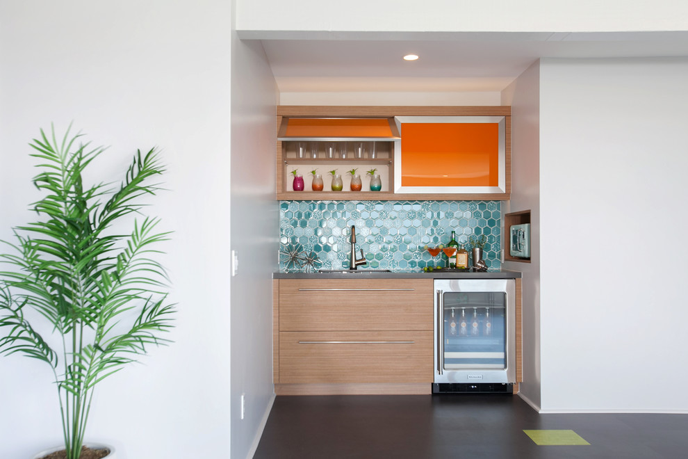 Design ideas for a contemporary single-wall wet bar in San Diego with flat-panel cabinets, medium wood cabinets and blue splashback.