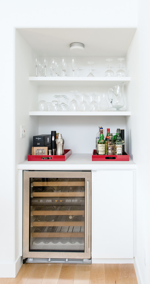 Photo of a small modern home bar in Orange County.