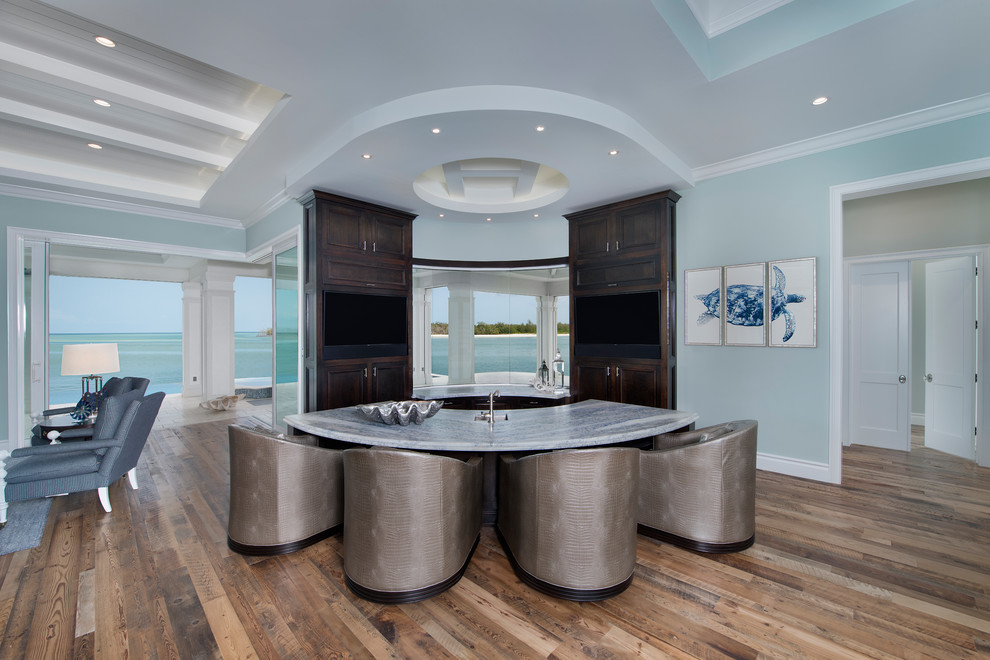 Mid-sized beach style u-shaped medium tone wood floor and brown floor wet bar photo in Other with quartzite countertops, raised-panel cabinets and dark wood cabinets