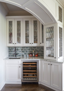 Wet Bar with Arched Opening and Glass Fronted Cabinetry - Traditional ...