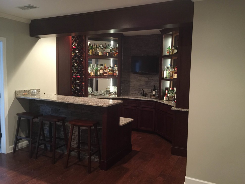 Example of a classic home bar design in Other