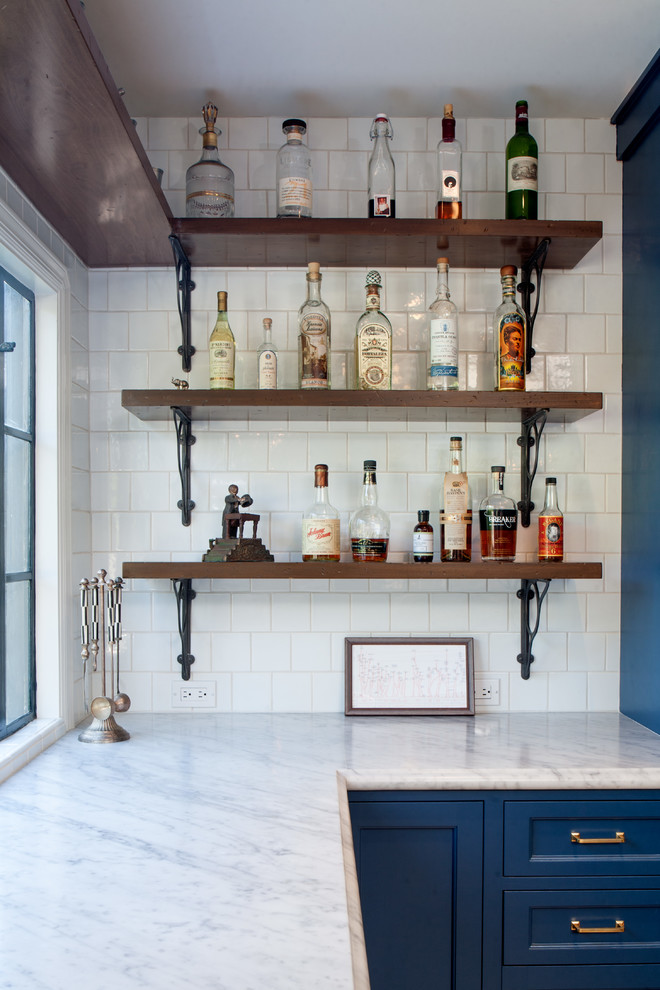 Inspiration for a large mediterranean home bar remodel in Los Angeles