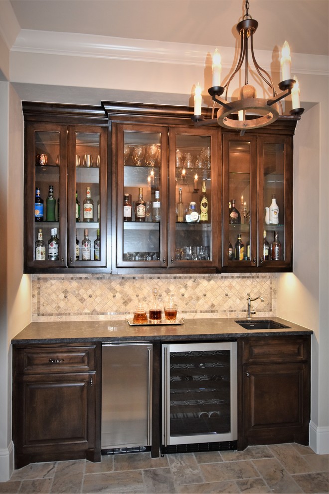Photo of a large classic home bar in Houston.
