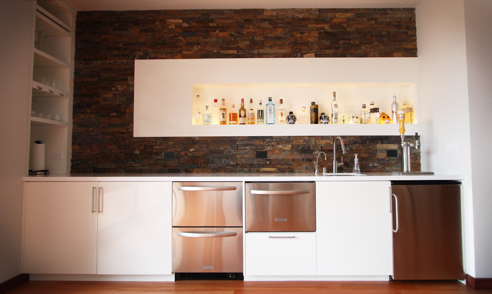 Example of an eclectic home bar design in Portland
