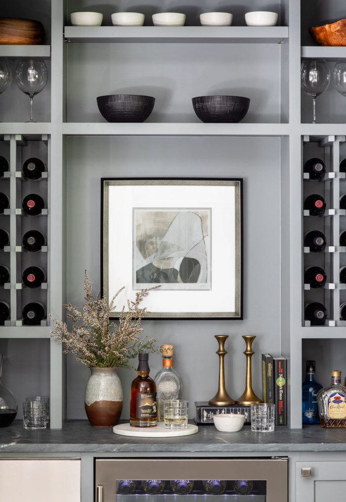 Inspiration for a mid-sized transitional single-wall home bar remodel in Houston with shaker cabinets, gray cabinets and gray countertops