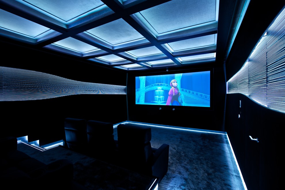 Example of a large trendy enclosed home theater design in Other with black walls and a projector screen