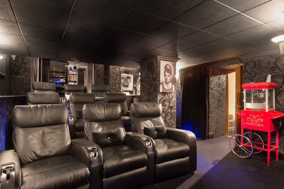 Photo of a medium sized contemporary enclosed home cinema in Devon with black walls, carpet and a projector screen.