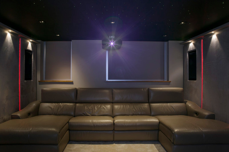Home theater - modern home theater idea in London