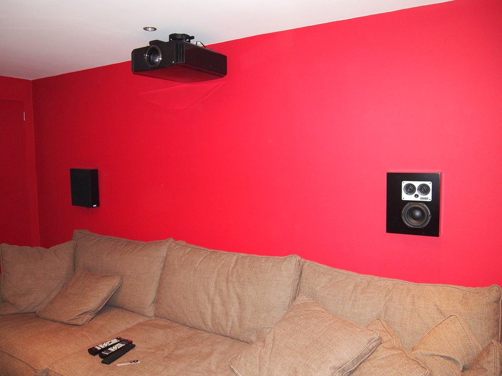 Home theater - small modern enclosed home theater idea in Surrey with a projector screen