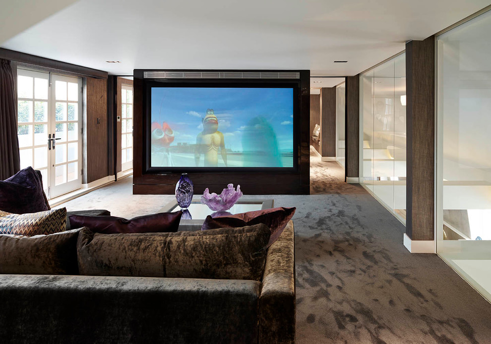 Photo of a contemporary home cinema in London with brown walls, carpet, a projector screen and brown floors.