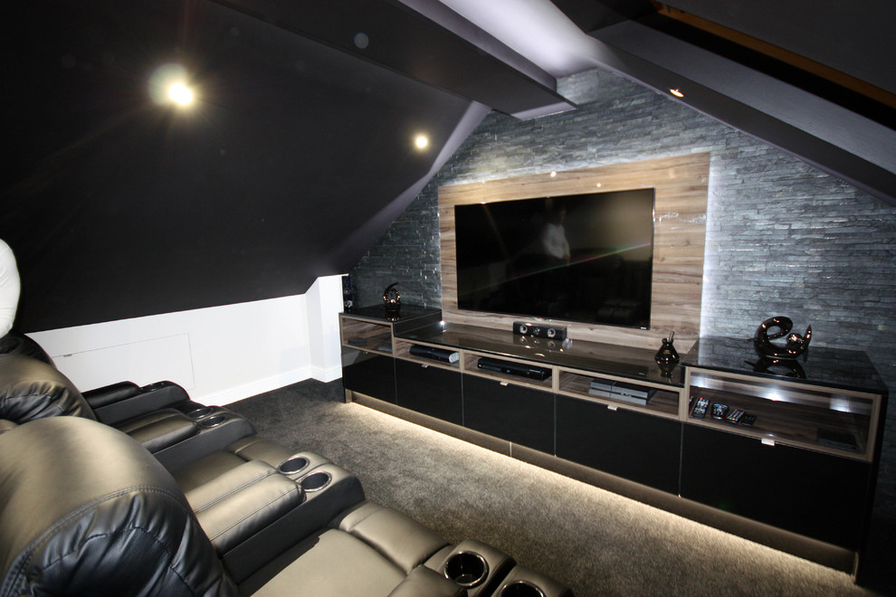Huge trendy open concept carpeted and gray floor home theater photo in Kent with gray walls