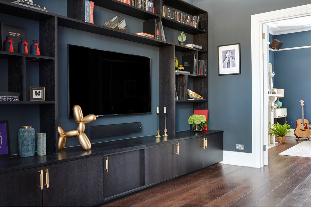 Inspiration for a mid-sized contemporary enclosed dark wood floor and brown floor home theater remodel in London with black walls and a wall-mounted tv