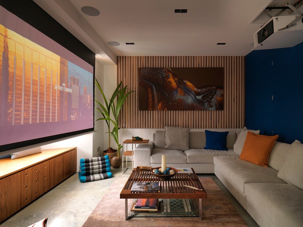 Contemporary home cinema in London with blue walls and a projector screen.