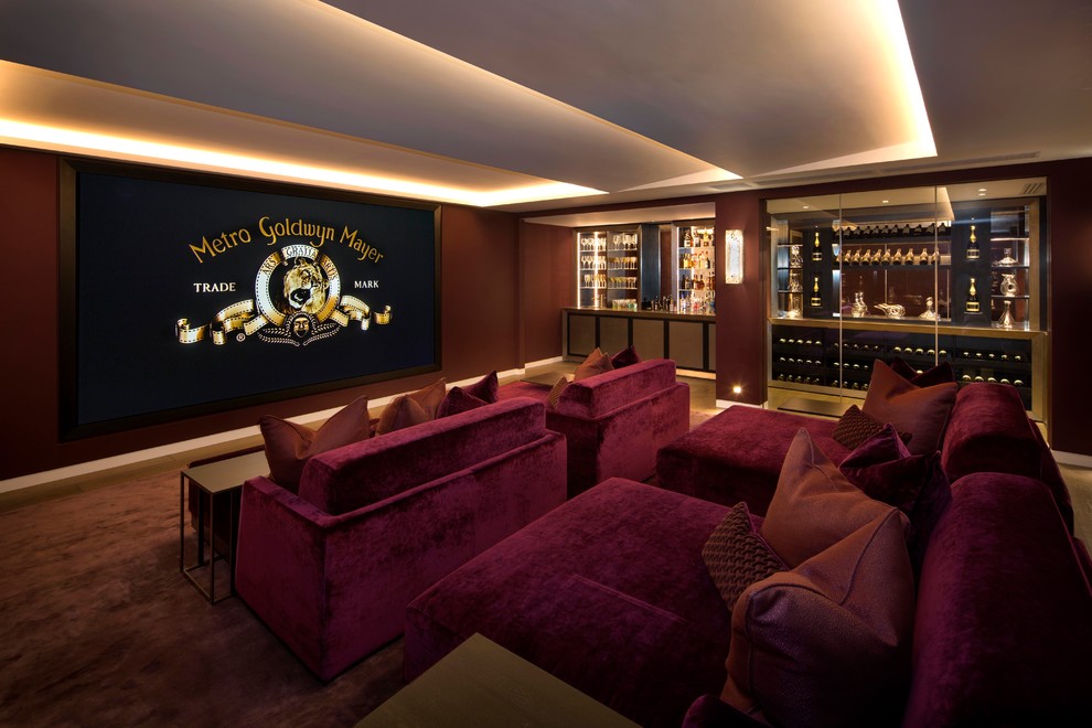 Inspiration for a contemporary enclosed home cinema in London with brown walls, carpet, a wall mounted tv and brown floors.
