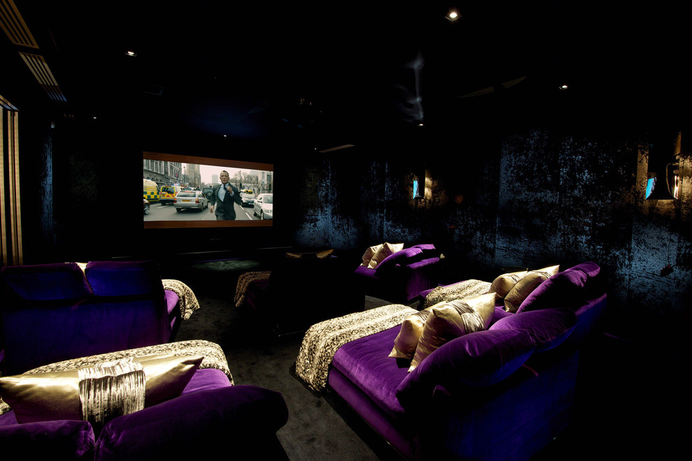 Large contemporary home cinema in Cheshire with black walls, carpet, a projector screen and black floors.