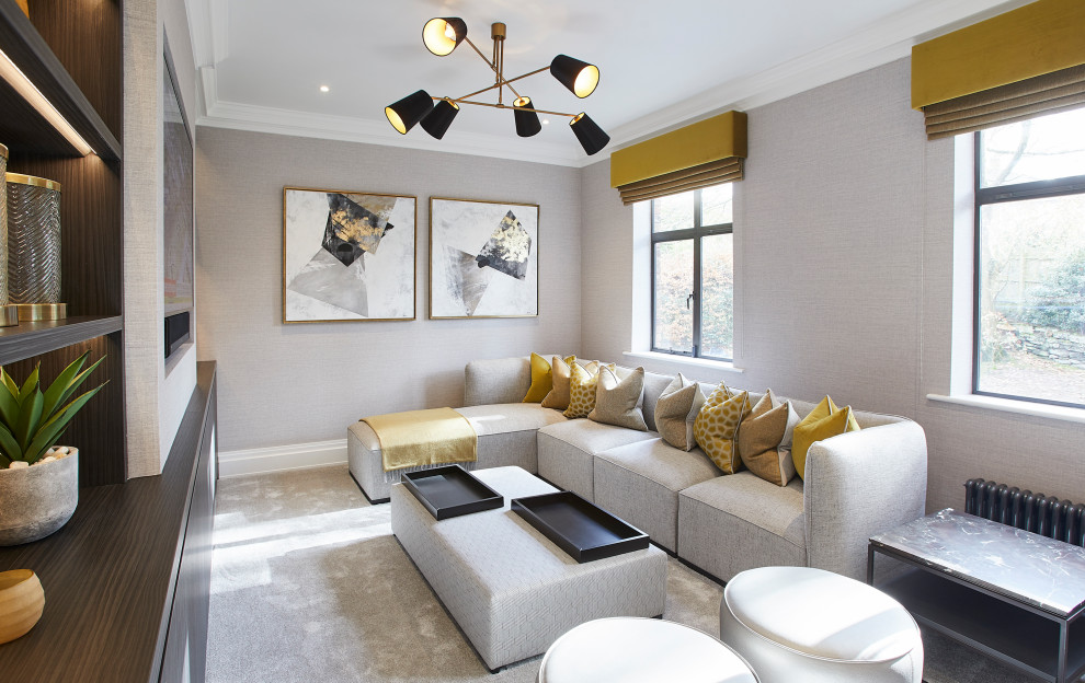Photo of a medium sized modern enclosed home cinema in Cheshire with beige walls, carpet, a built-in media unit and beige floors.