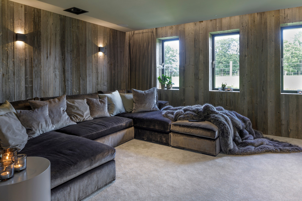 Design ideas for a medium sized contemporary enclosed home cinema in Cheshire with carpet, a built-in media unit and grey floors.