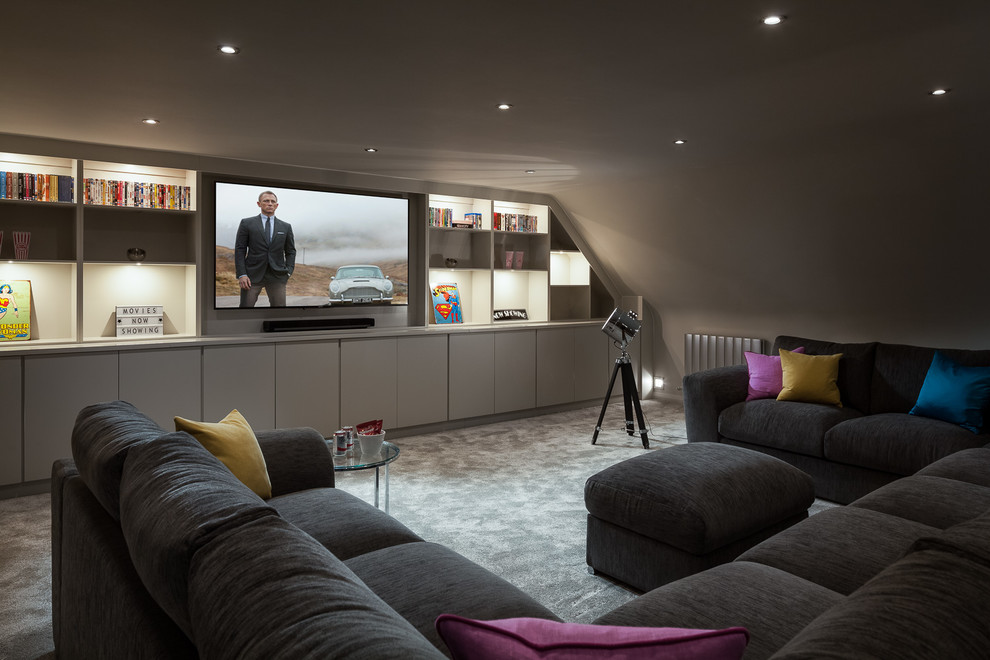 This is an example of a contemporary home cinema in Surrey.