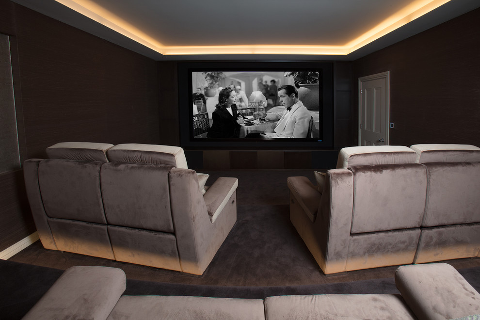 Design ideas for a large modern enclosed home cinema in London with brown walls, carpet, a projector screen and brown floors.