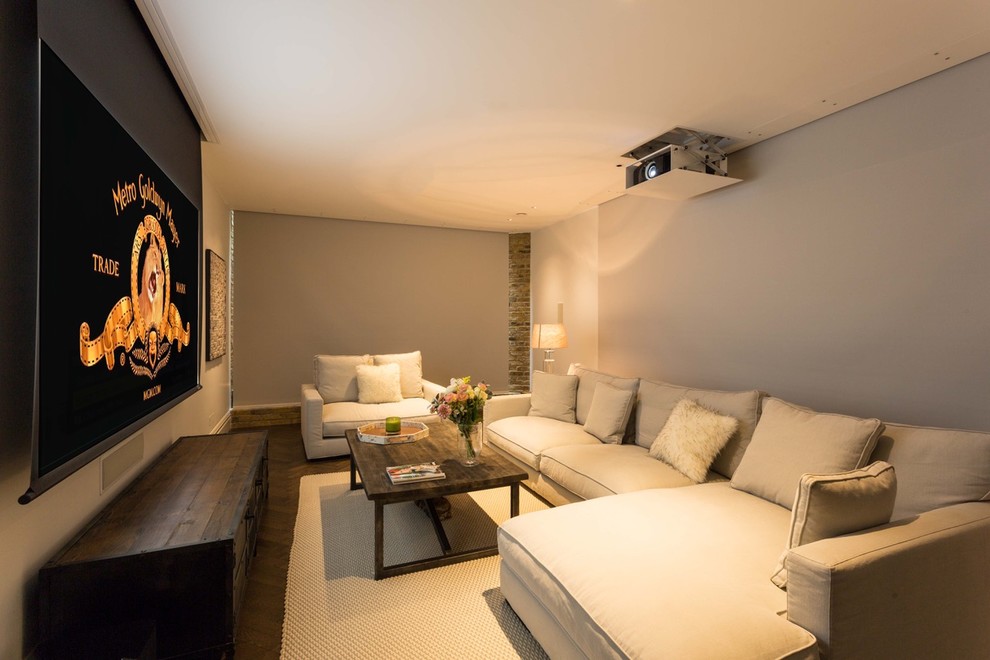Medium sized contemporary enclosed home cinema in London with grey walls, dark hardwood flooring, a projector screen and brown floors.