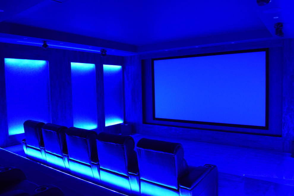 Expansive contemporary home cinema in Cheshire with a built-in media unit.