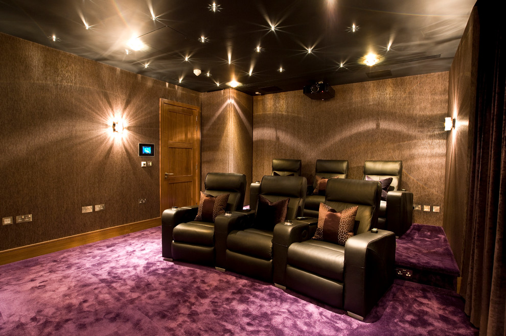 Inspiration for a mid-sized modern enclosed home theater remodel in Cheshire with a projector screen