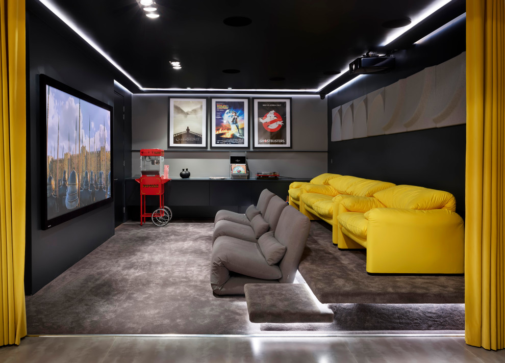 Home theater - contemporary home theater idea in London with a projector screen