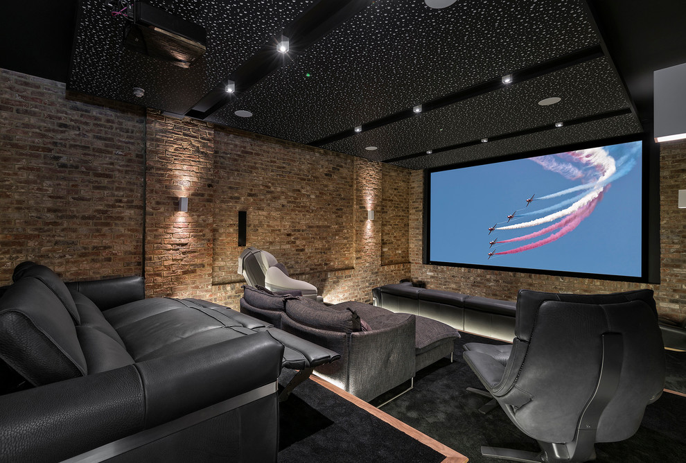 Photo of a large contemporary enclosed home cinema in Hampshire with carpet and a projector screen.