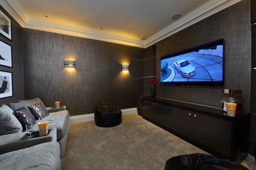 Inspiration for a contemporary home cinema in London with brown walls, carpet, a wall mounted tv and beige floors.