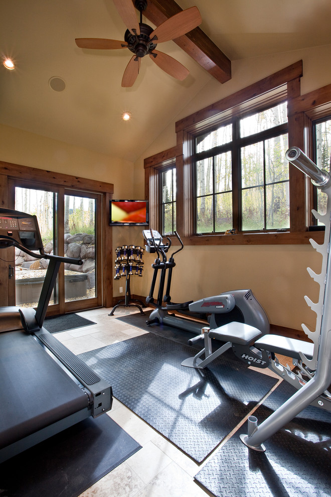 Inspiration for a rustic home gym in Salt Lake City with beige walls and feature lighting.