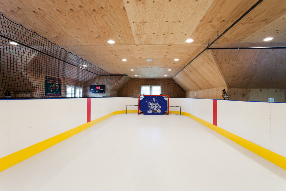 Inspiration for a classic indoor sports court with beige walls and white floors.