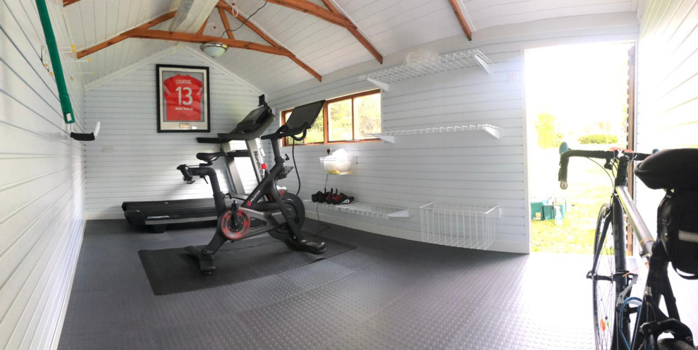 Home gym - modern gray floor and vaulted ceiling home gym idea in Buckinghamshire