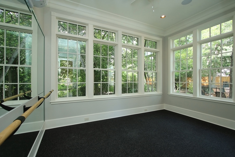 Example of a small classic cork floor and multicolored floor multiuse home gym design in Houston with gray walls