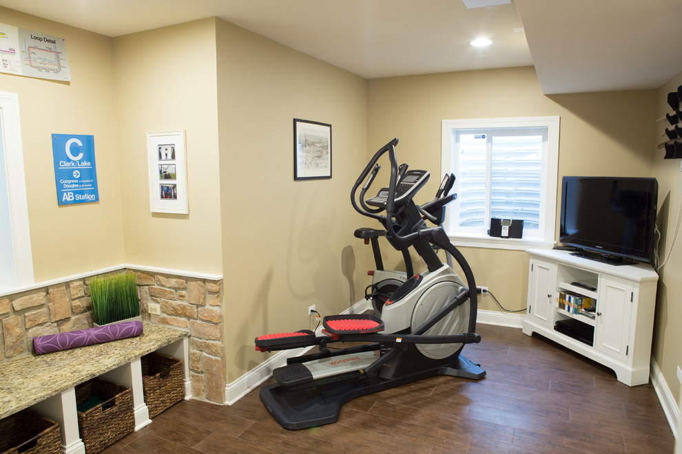 Design ideas for a small traditional multi-use home gym in Chicago with beige walls, dark hardwood flooring and brown floors.