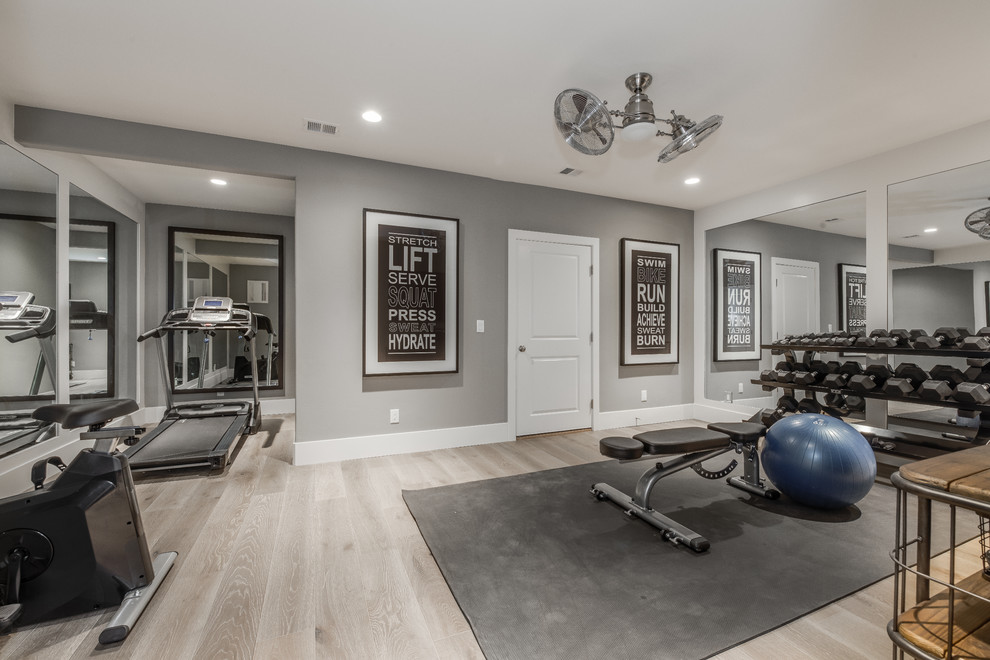 Example of a large classic light wood floor and beige floor multiuse home gym design in Salt Lake City with gray walls
