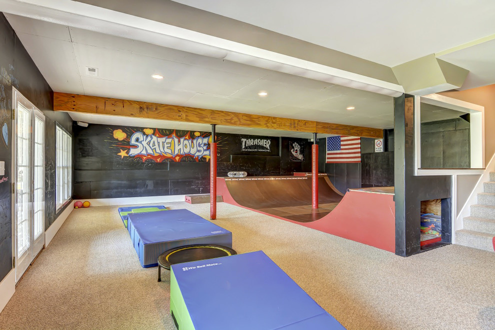 This is an example of a large contemporary home gym in Charlotte with carpet.