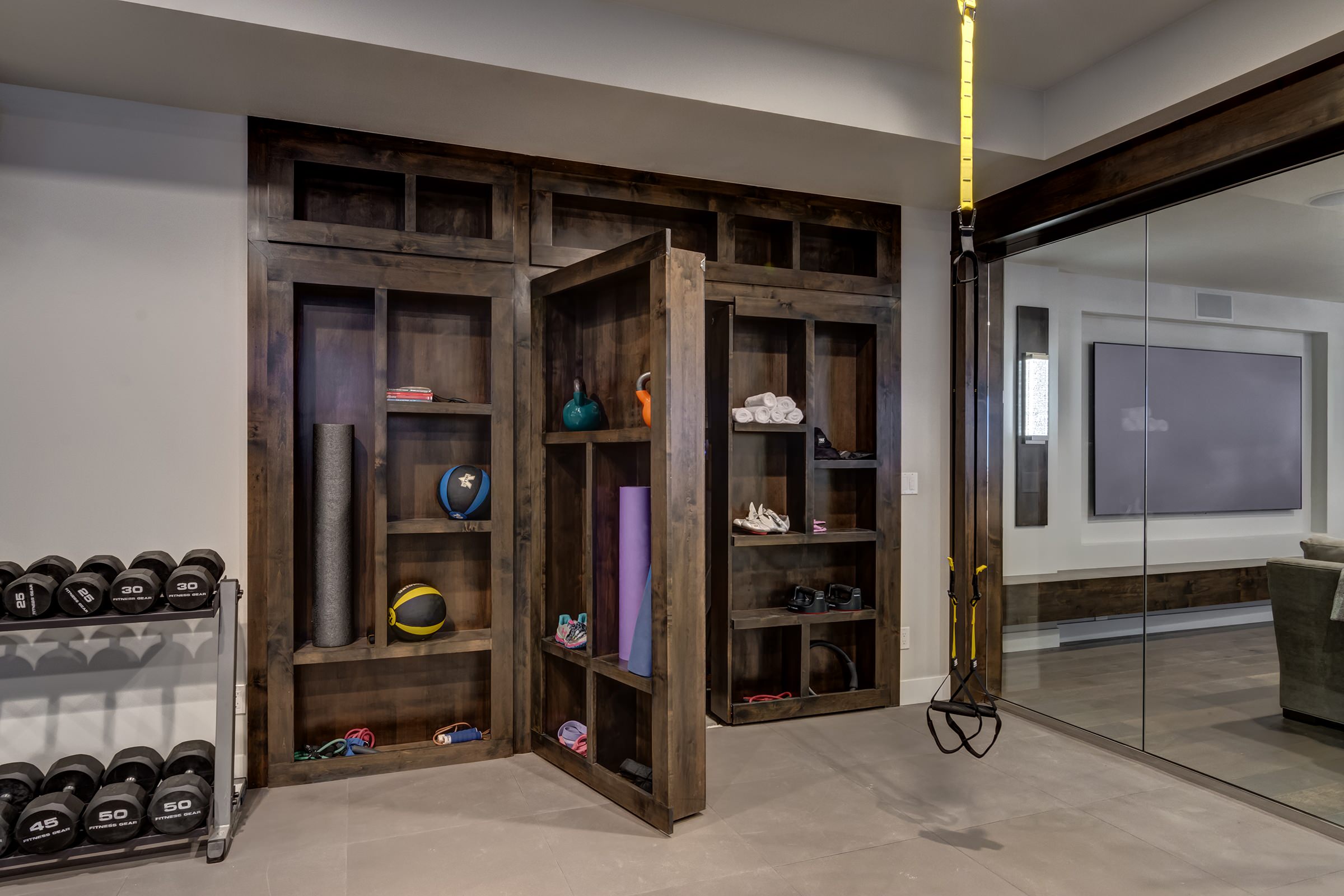 Basement Gym with Hidden Bookcase open - Transitional - Home Gym - Denver -  by FBC Remodel | Houzz