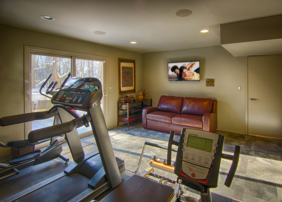 Medium sized contemporary multi-use home gym in Detroit with green walls and vinyl flooring.