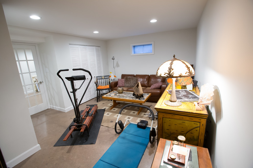 Design ideas for a small modern multi-use home gym in Boston with white walls and grey floors.