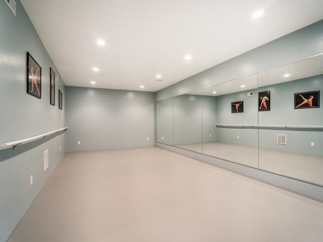 Example of a large transitional home yoga studio design in Salt Lake City with gray walls