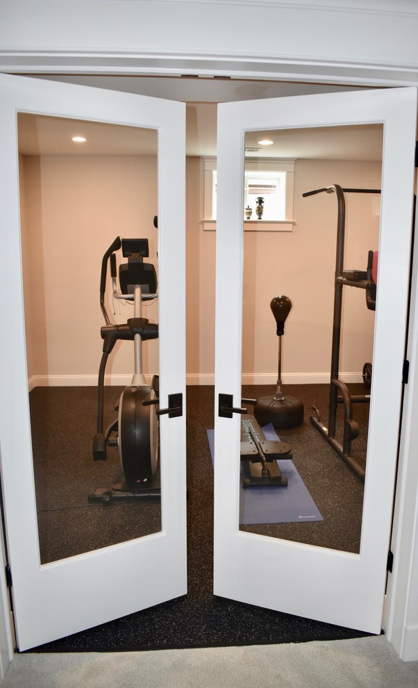 Small transitional black floor multiuse home gym photo in DC Metro with beige walls
