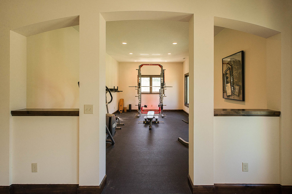 Photo of a large traditional multi-use home gym in Minneapolis with white walls and cork flooring.