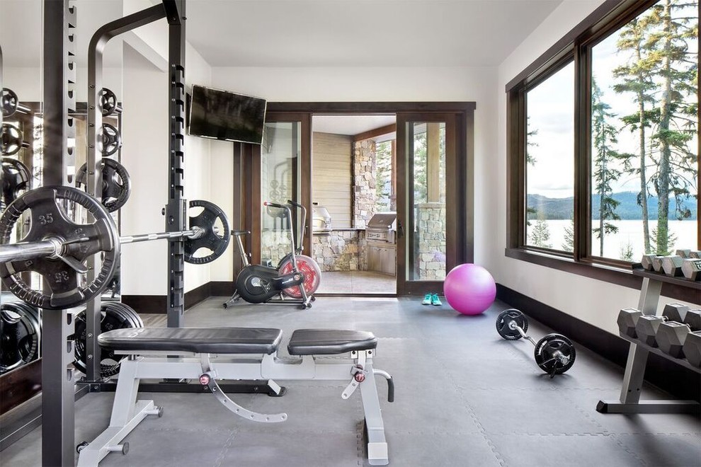 Inspiration for a mid-sized rustic gray floor multiuse home gym remodel in Other with white walls