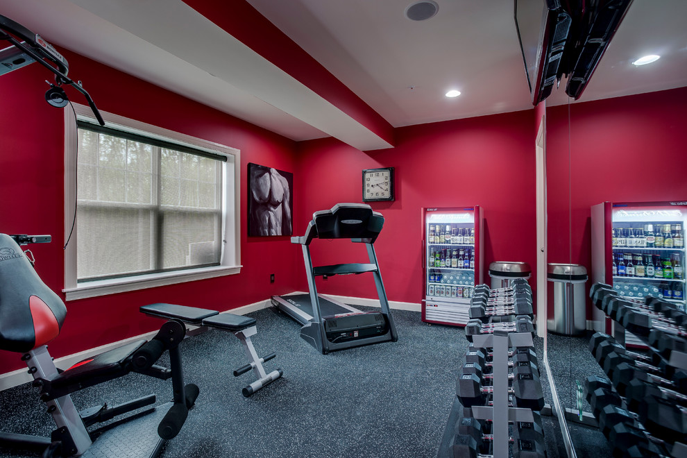 Idées déco pour une salle de musculation contemporaine de taille moyenne avec un mur rouge, moquette et un sol gris.